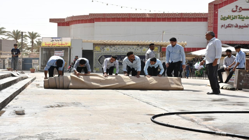 أعمال غسل وتنظيف الساحات والفضاءات الخارجية والاشجار